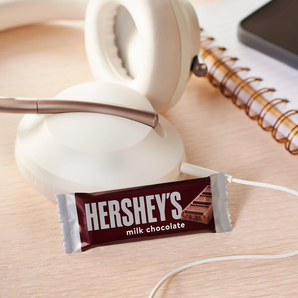HERSHEY'S Milk Chocolate snack-size bars at a desk for office snacking