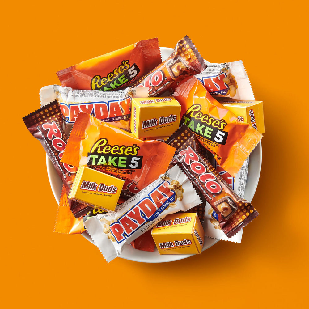 Hershey's Milk Duds chocolate caramel bites, classic movie-night snack.