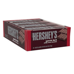 HERSHEY'S Special Dark bars closeup showing glossy chocolate melt and smooth texture.