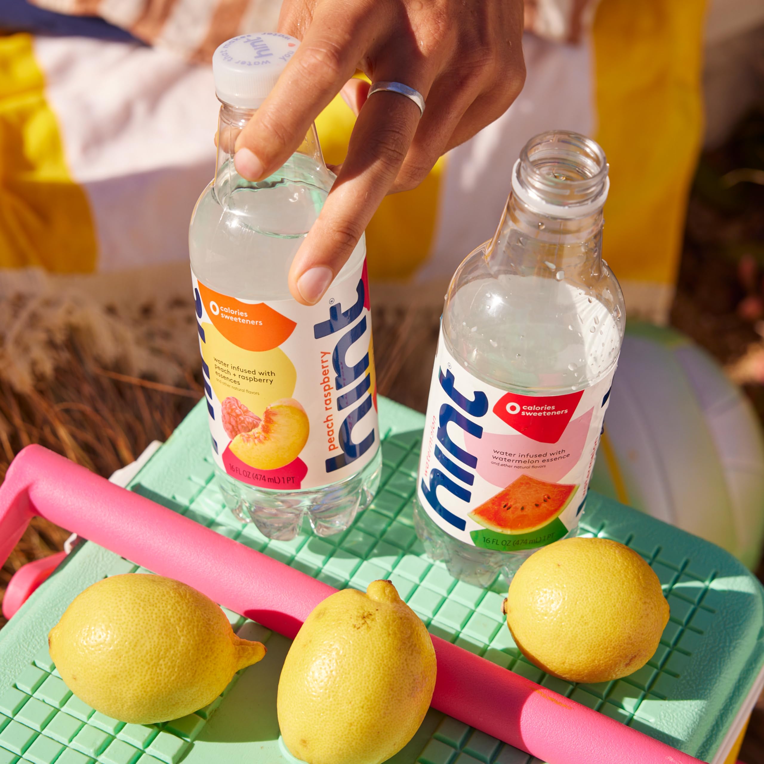 Hint bottle on a desk demonstrates convenient on-the-go hydration for busy days.