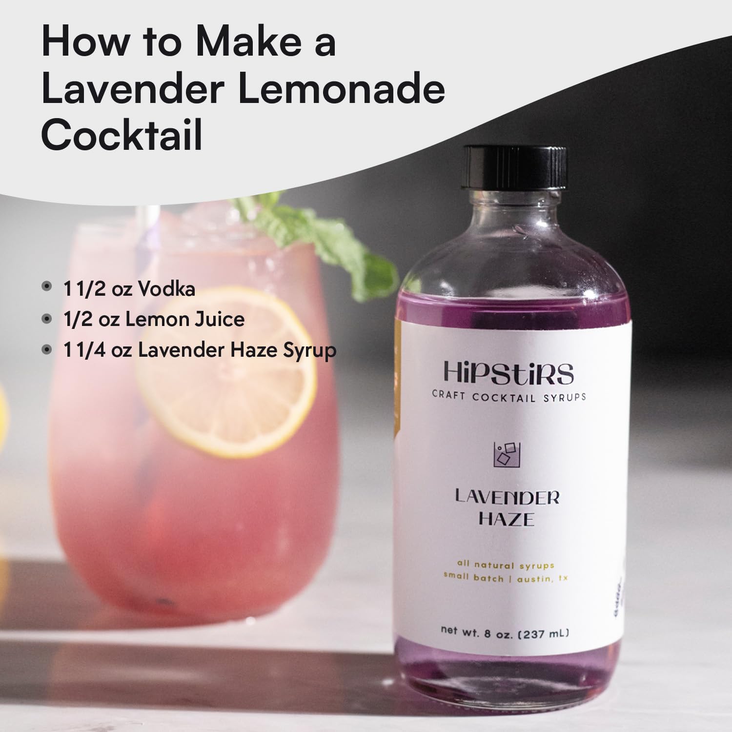 HipStirs Lavender Haze Syrup in a cocktail glass suggests versatile floral mixology.
