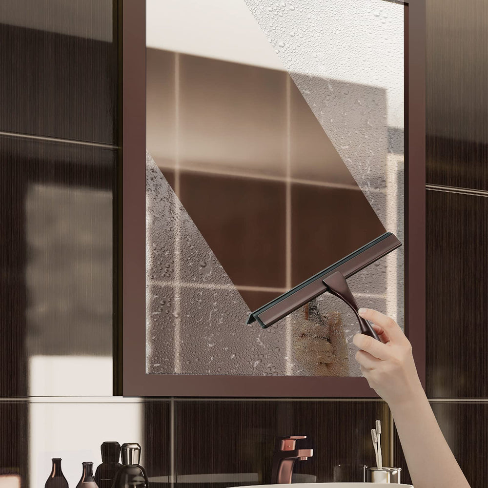 Hiware squeegee in action cleaning a shower door for a smooth finish