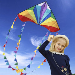 Honbo delta kite with 13ft rainbow tails fluttering for kids and families.