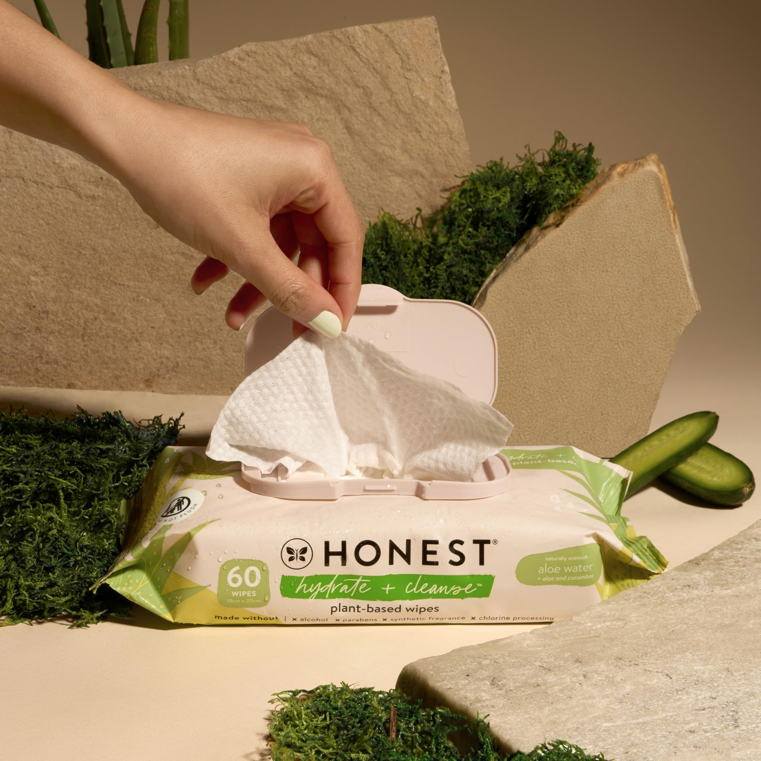 The Honest Company Hydrate and Cleanse wipes in car front seat for on-the-go freshening.