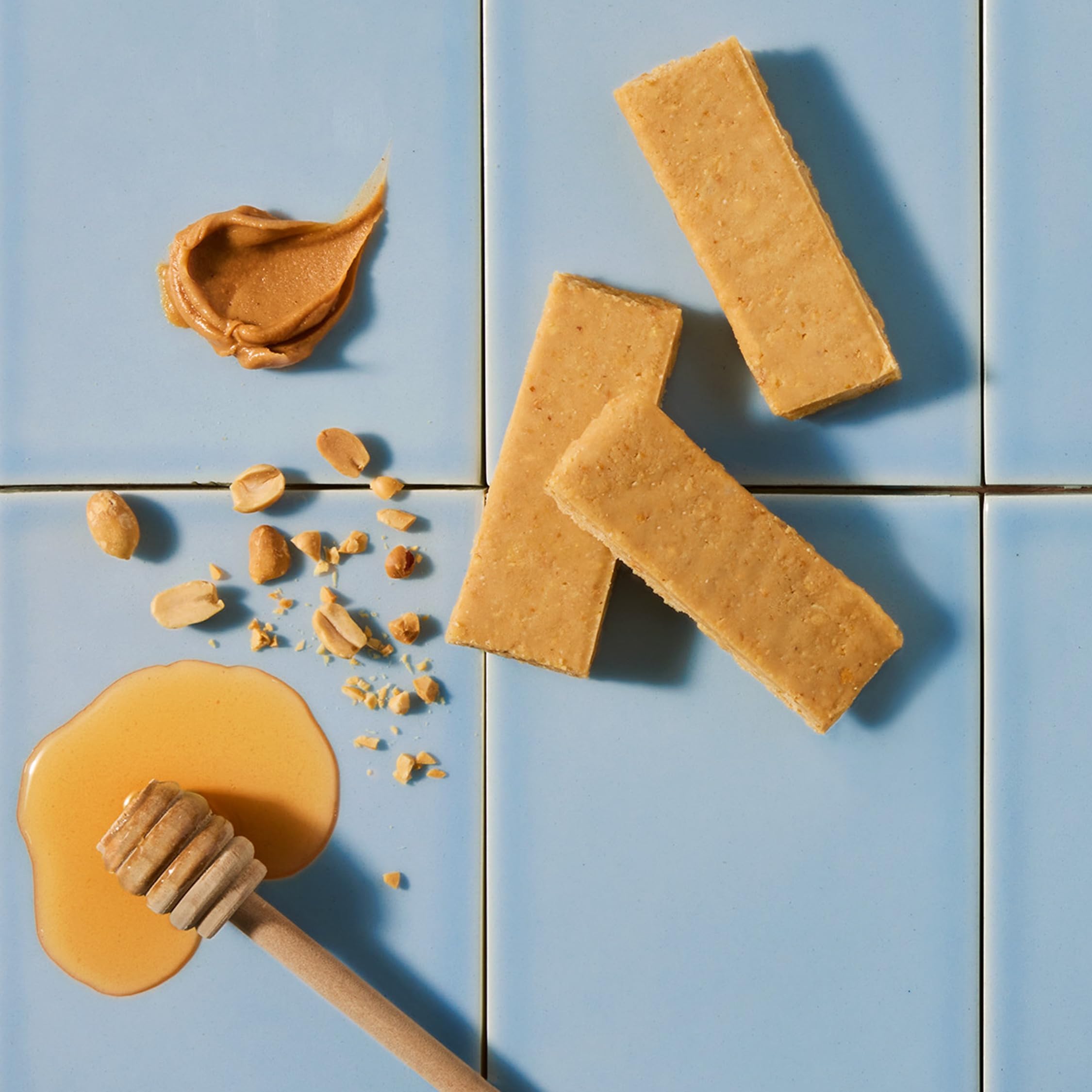 Bar on wooden surface emphasizes premium, low-ingredients snack option.