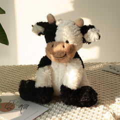 Hopearl 9-inch plush cow toy features weighted design for stable seating.