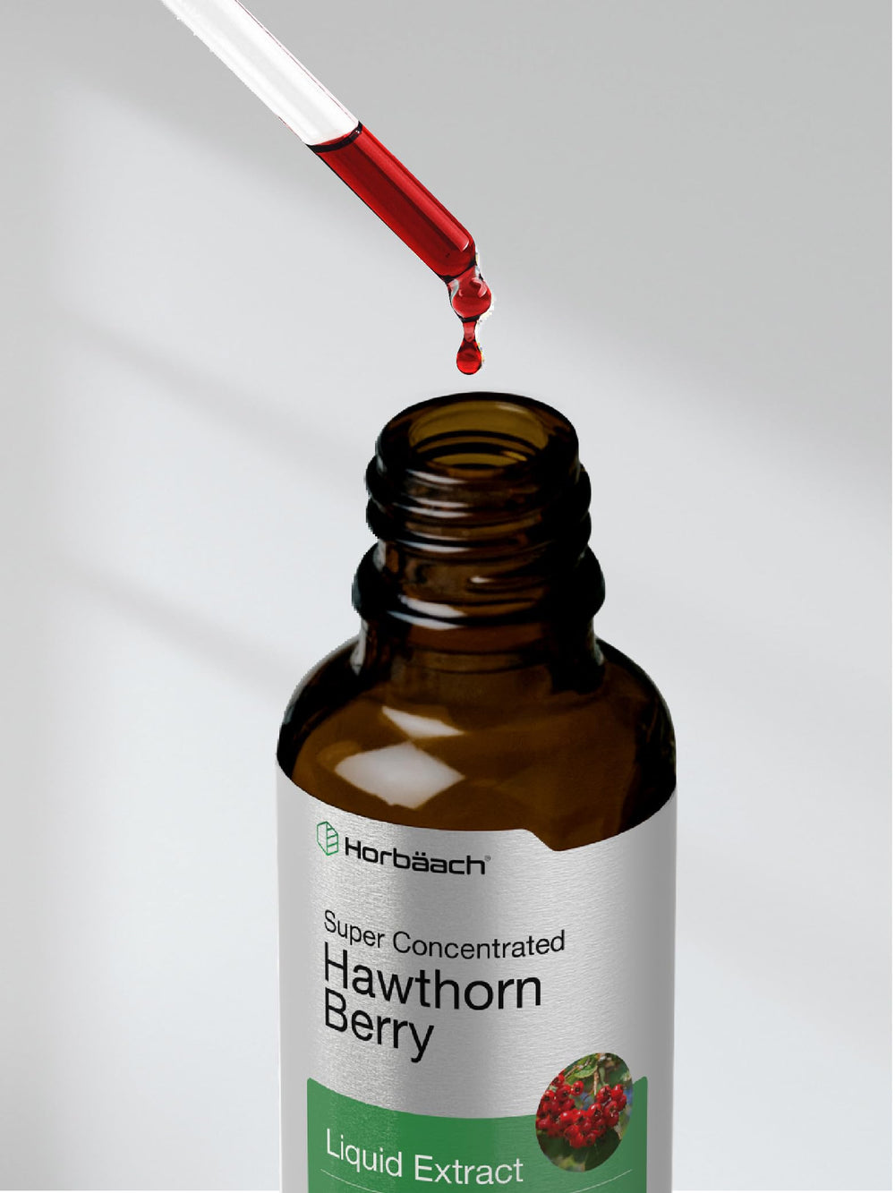 Pour of Horbaach Hawthorn Berry Extract into water for convenient use