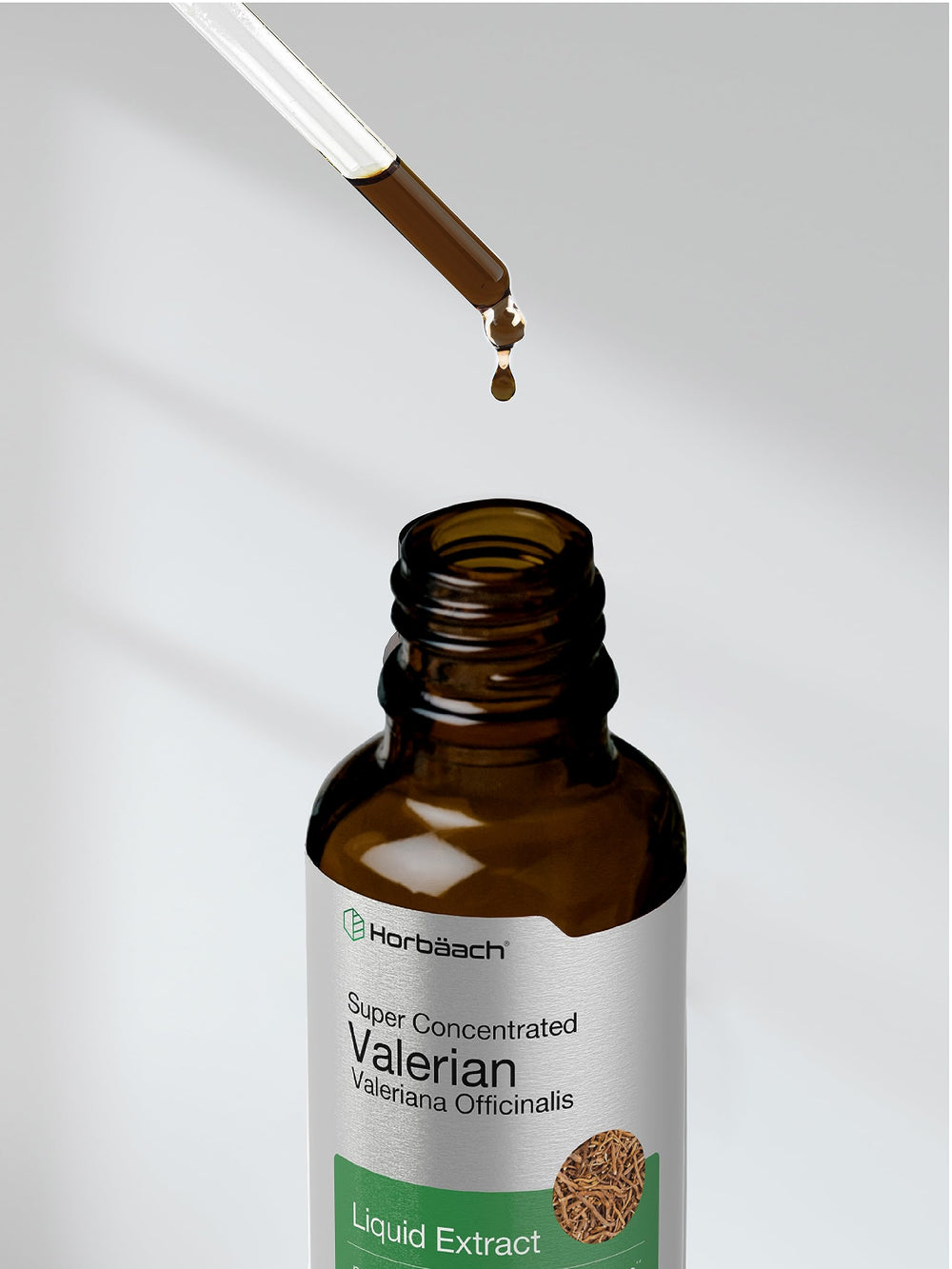 Horbäach Valerian Root Drops on nightstand paired with dim light for calm evenings.
