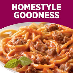 HORMEL COMPLEATS serving in bowl, steaming pasta with flavorful sauce.