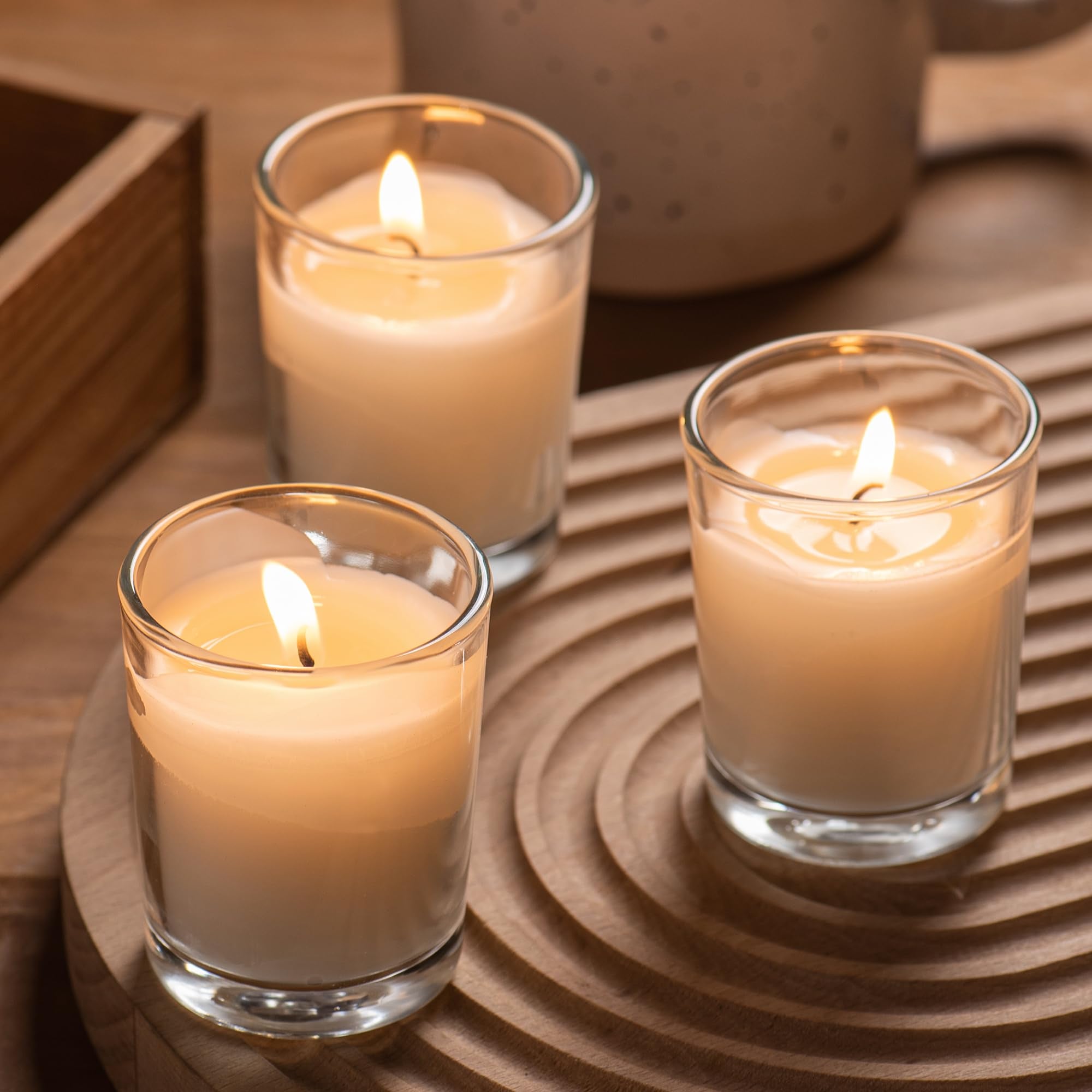 Housecret clear glass votives enhance table centerpieces and decor.