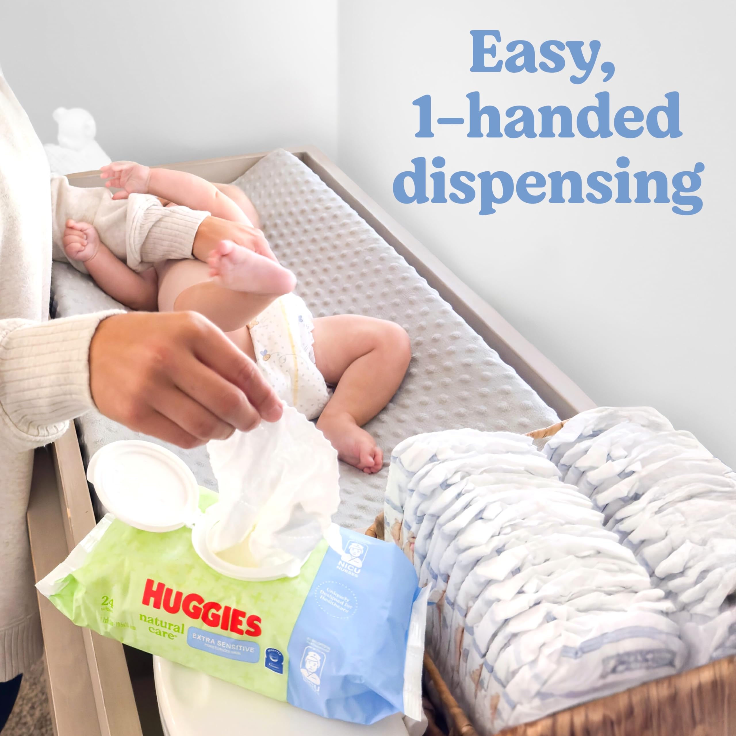 Flip-top dispense closeup showing one-handed use of Huggies wipes