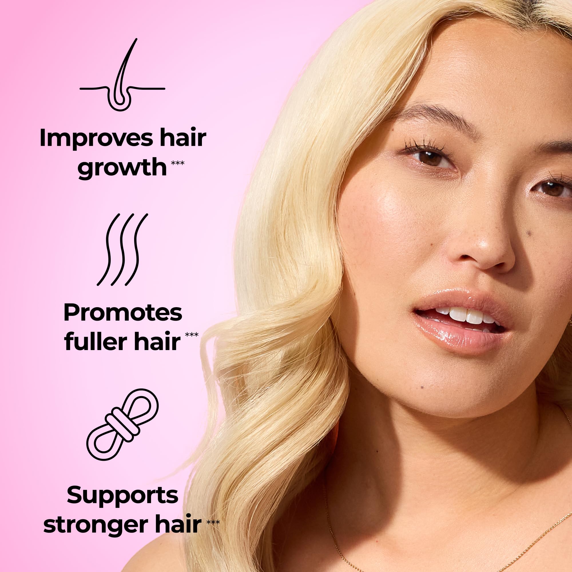 Close-up of HUM Hair Strong strawberry gummies for daily nourishment