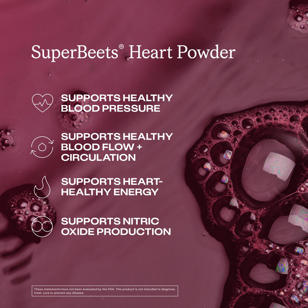 Glass of black cherry Humann SuperBeets drink after mixing.