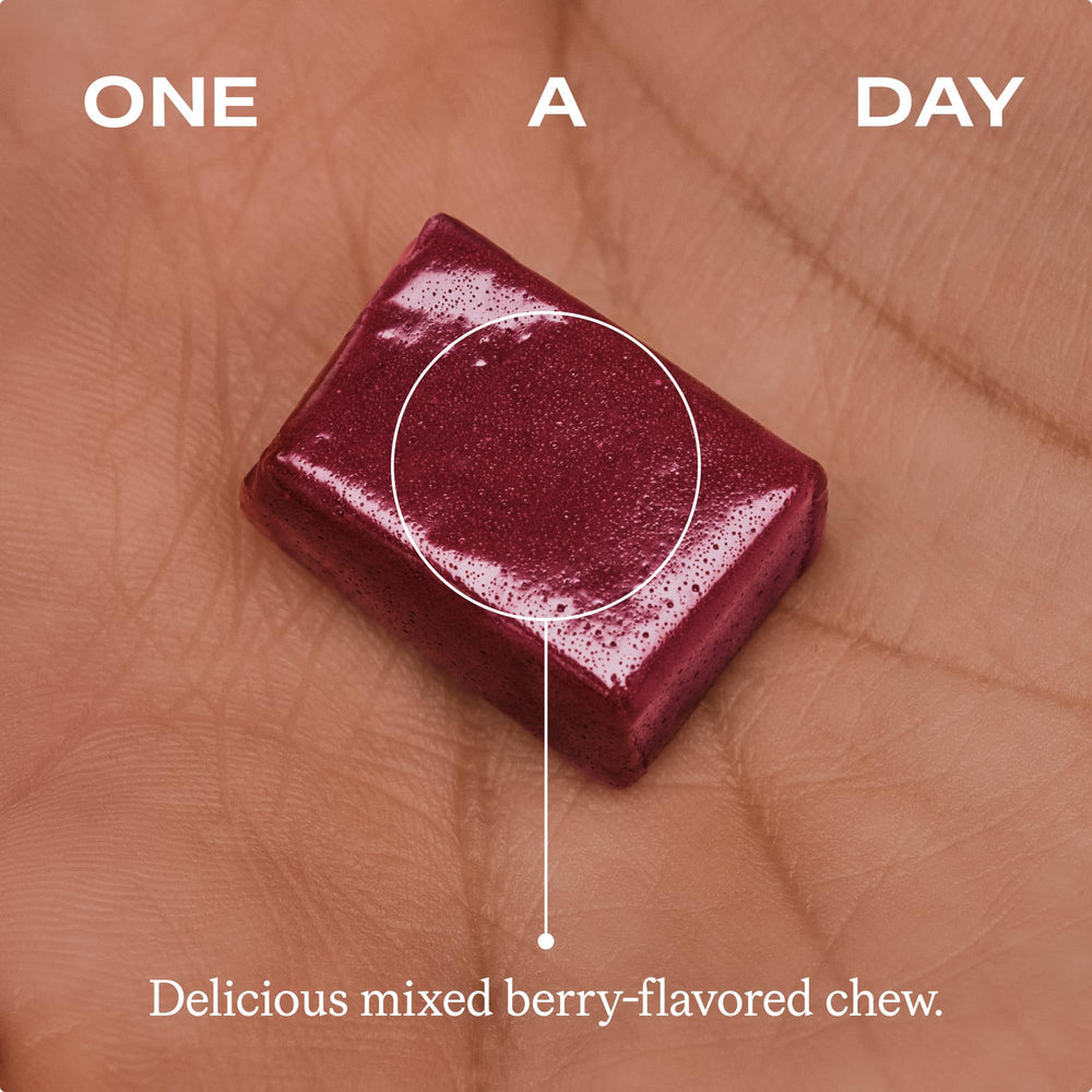 Humann Vitamin D3 + K2 Chews beside water glass suggests daily dose with hydration.