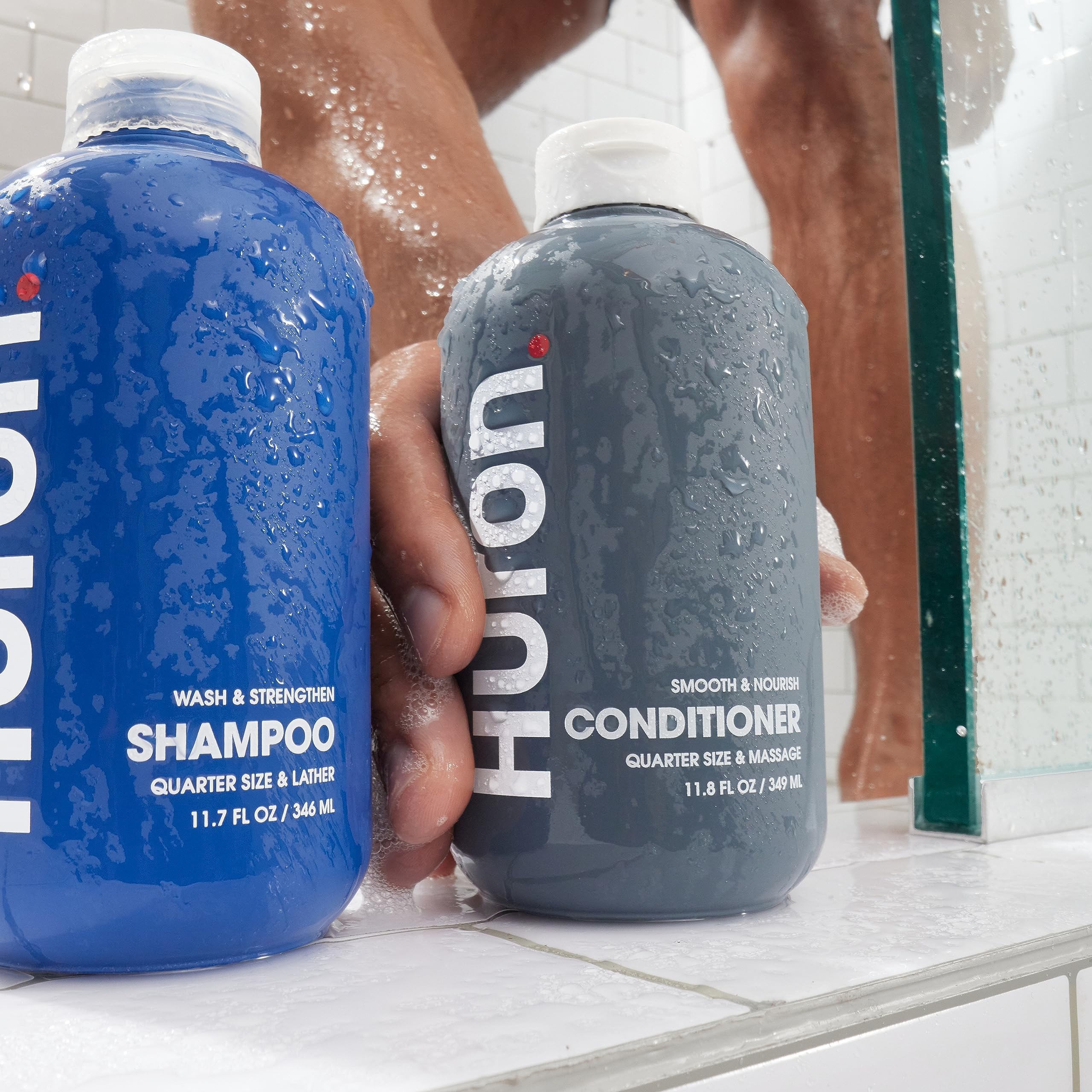 Huron Men’s Conditioner bottle displayed on a bathroom shelf.