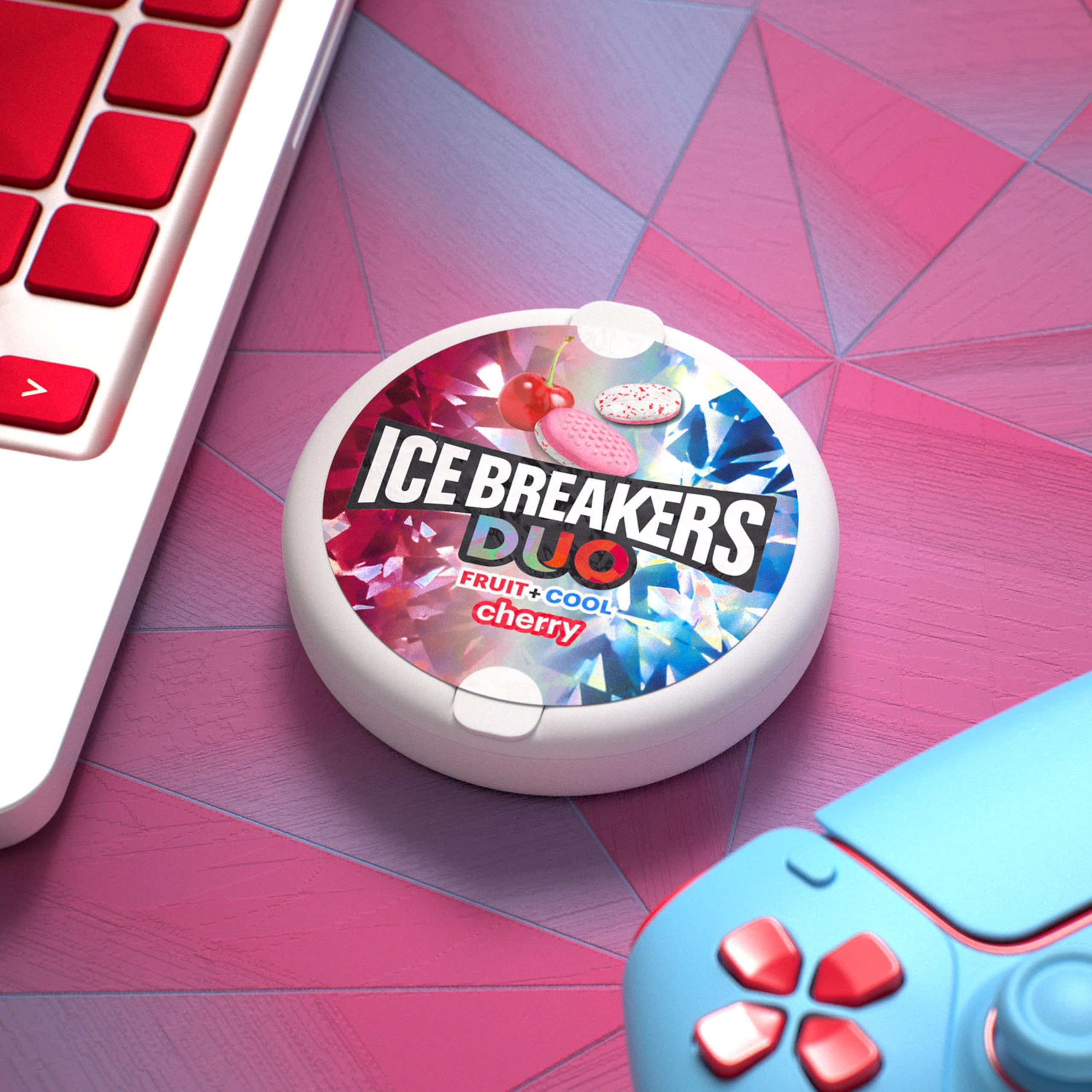 Ice Breakers Duo cherry flavor puck in hand for quick bite