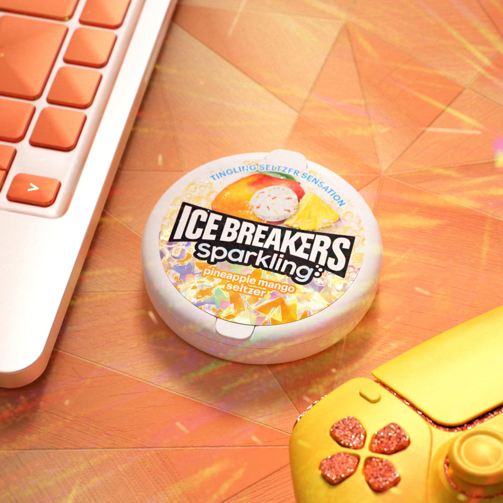 Ice Breakers sparkling pineapple mango at party table suggests social, sugar-free mint options.