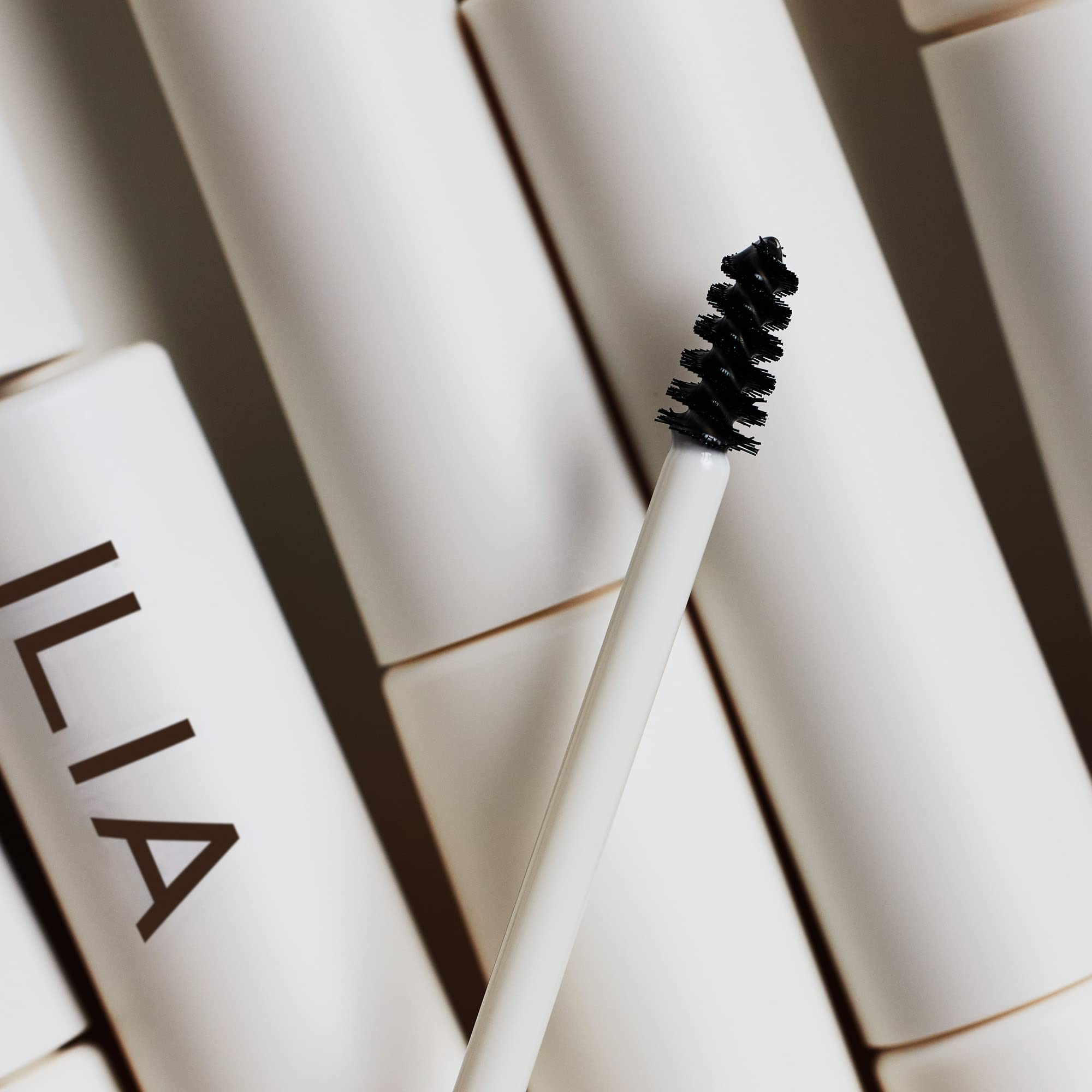 ILIA Hydrolyzed Quinoa Hair Renewal Complex concept shown for brow conditioning.