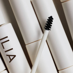 ILIA Hydrolyzed Quinoa Hair Renewal Complex concept shown for brow conditioning.