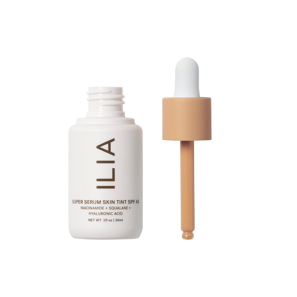 ILIA bottle closeup shows premium texture and dewy finish.