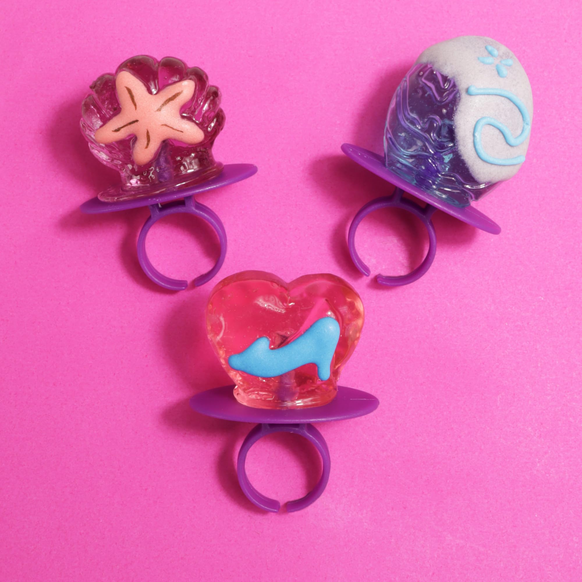 Bulk candy lollipop rings with assorted flavors: watermelon, grape, strawberry.