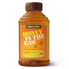 In The Raw Organic Honey 14oz bottle pour highlights smooth sweetness for tea and coffee.