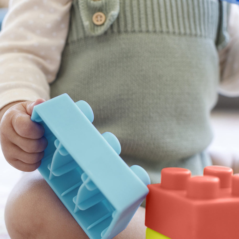 Infantino blocks in different sizes promote fine motor skills and problem-solving during play.