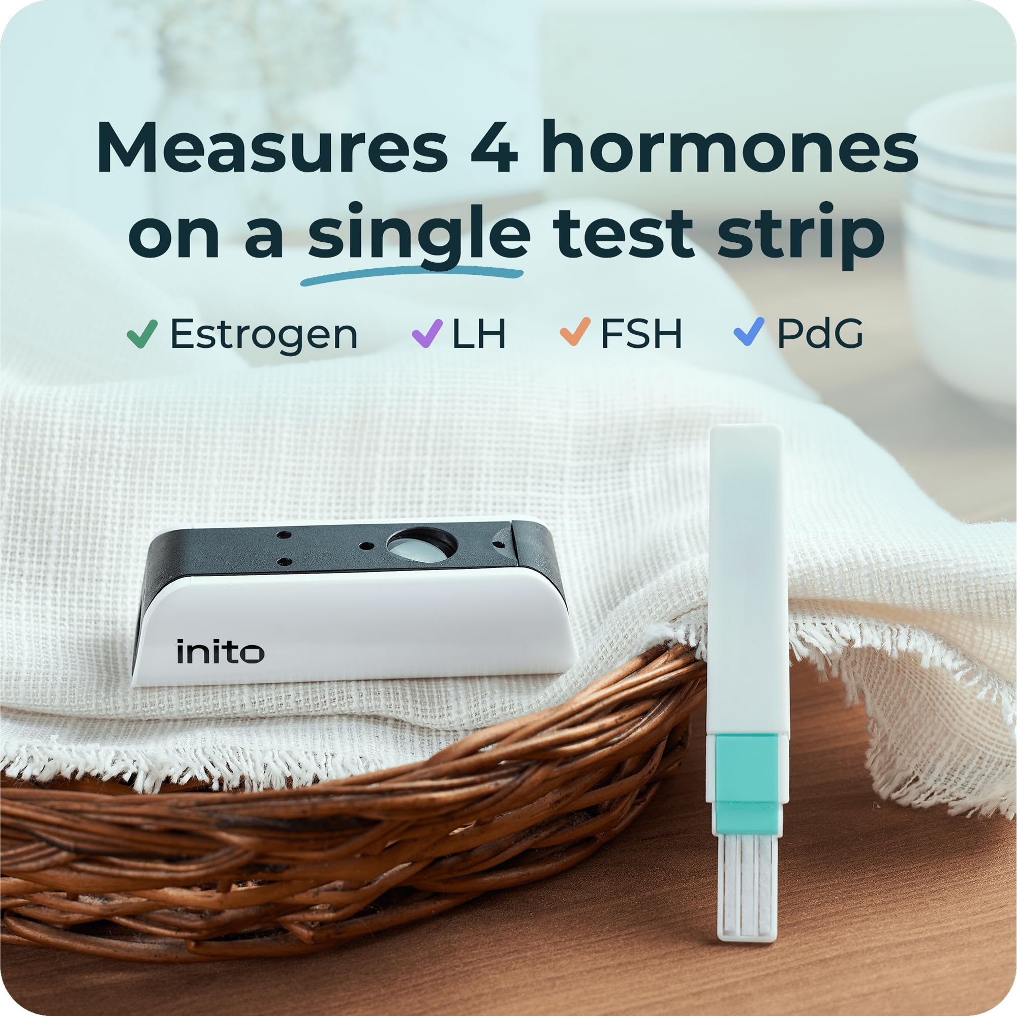 Inito test strip being dipped for a quick 15-second urine test