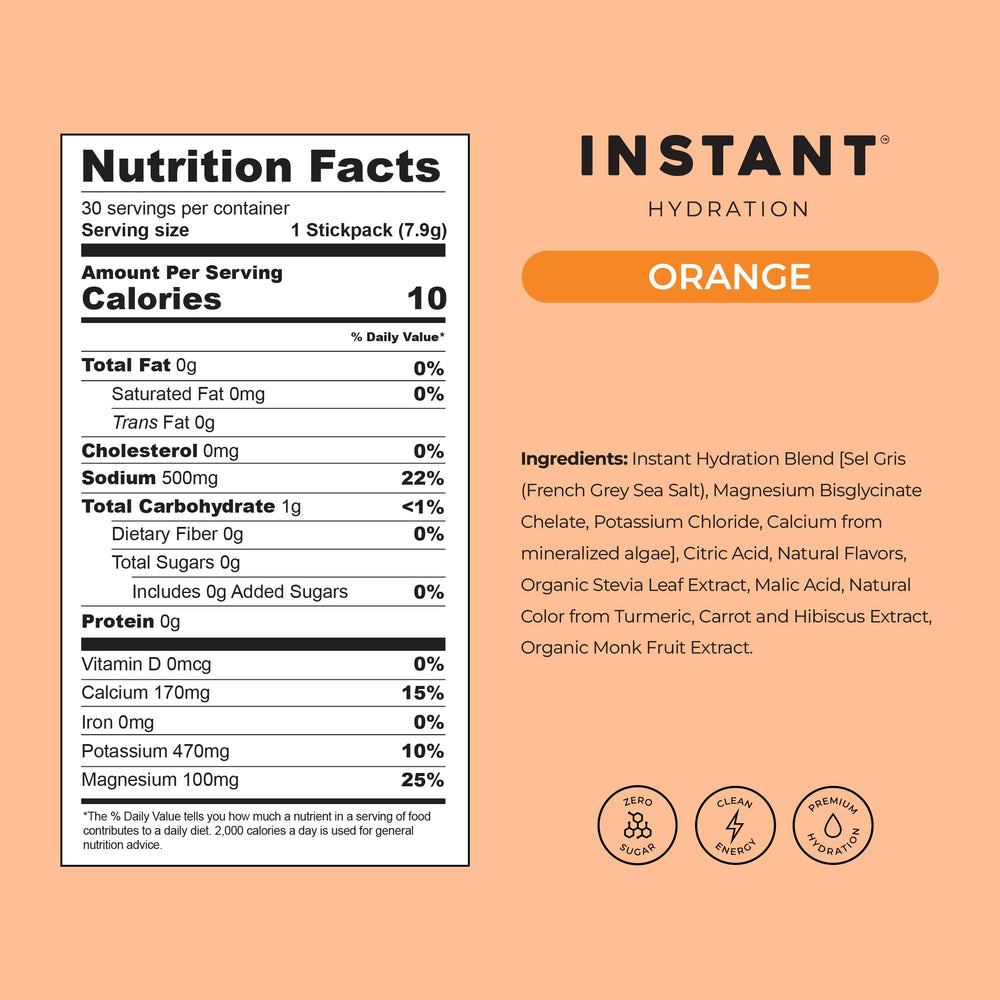 Instant Hydration orange drink mix dissolving in water for a bright flavor.