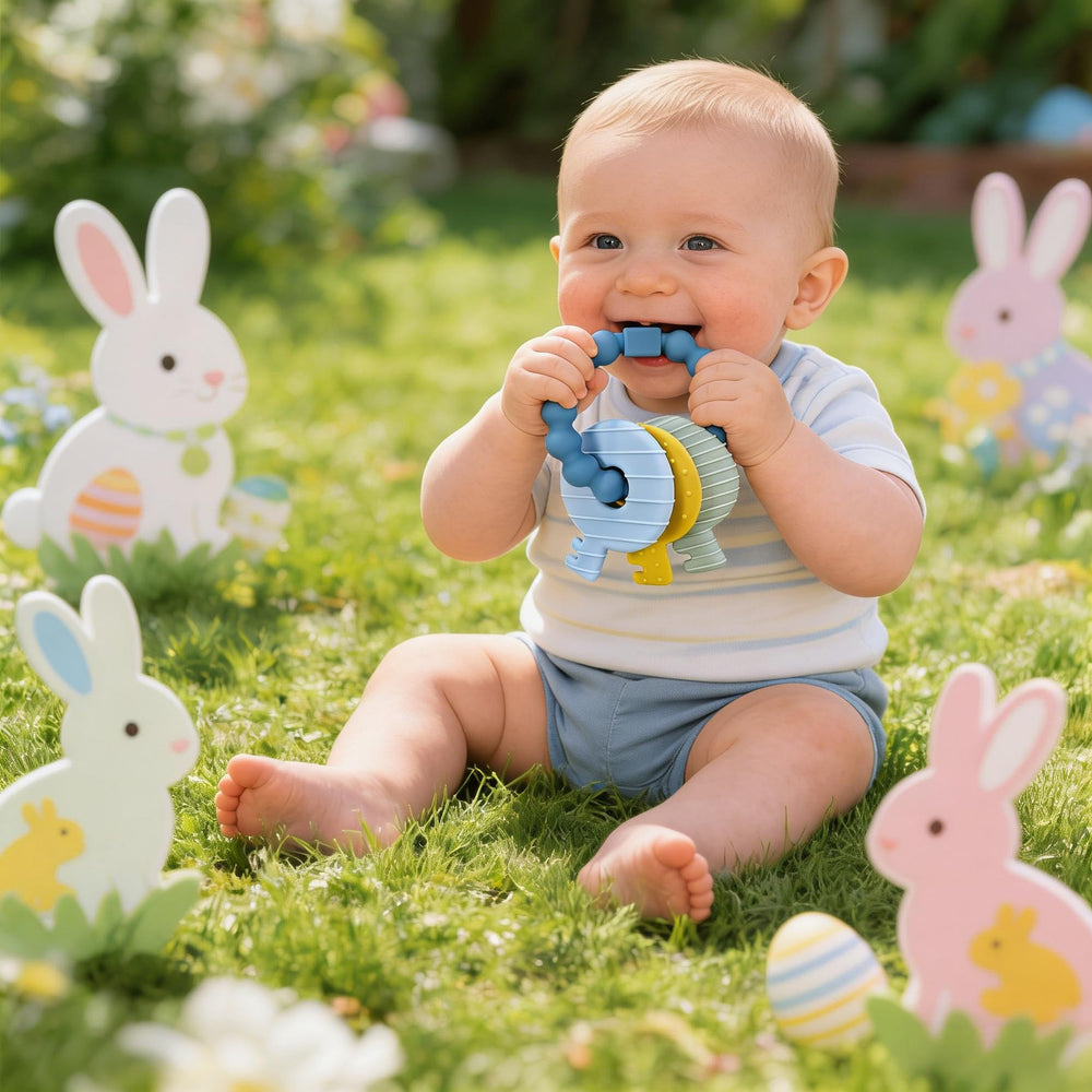 Intatikoo silicone teether showcases raised textures to stimulate tactile exploration.