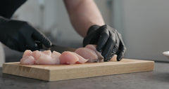 Intco Black Nitrile Gloves wrist fit demonstrates a snug cuff for secure handling.
