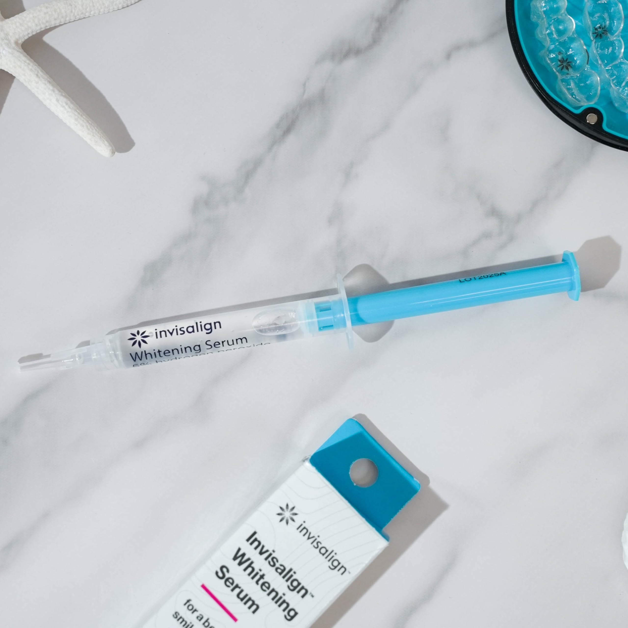 Invisalign whitening serum closeup mint texture emphasizes refreshing flavor during routine.