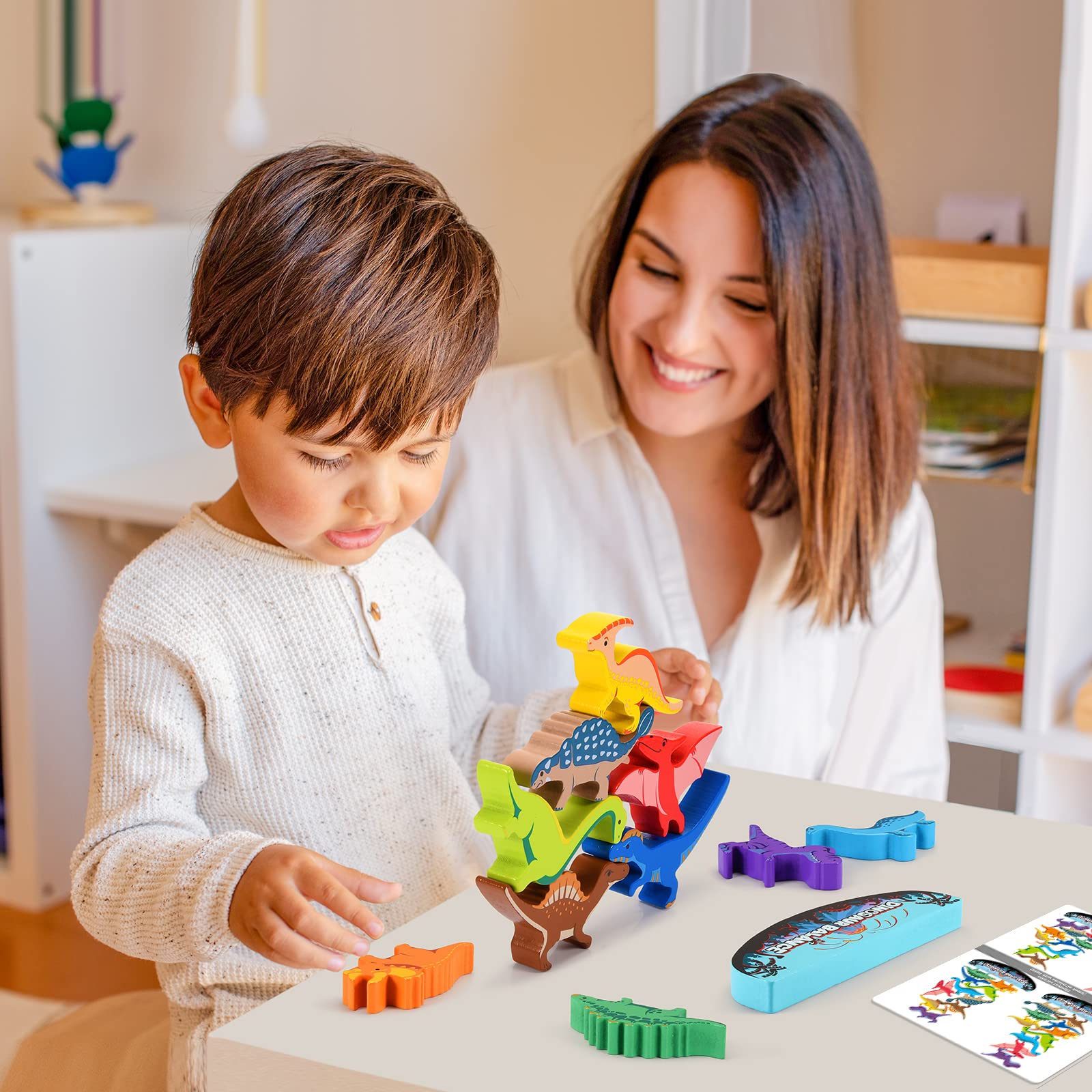 IPOURUP dinosaur fans enjoy wooden blocks in the playroom.