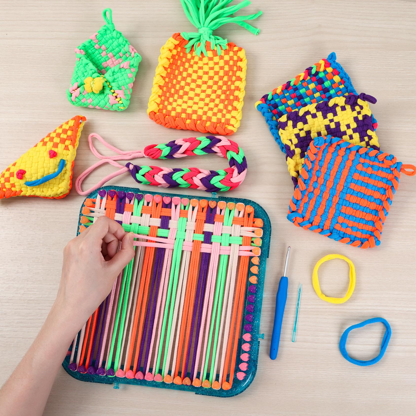 IQKidz weaving loom kit storage box keeps pieces organized and portable.