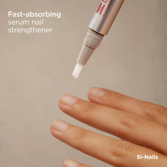 ISDIN Si-Nails applicator brush close-up for precise nail care.