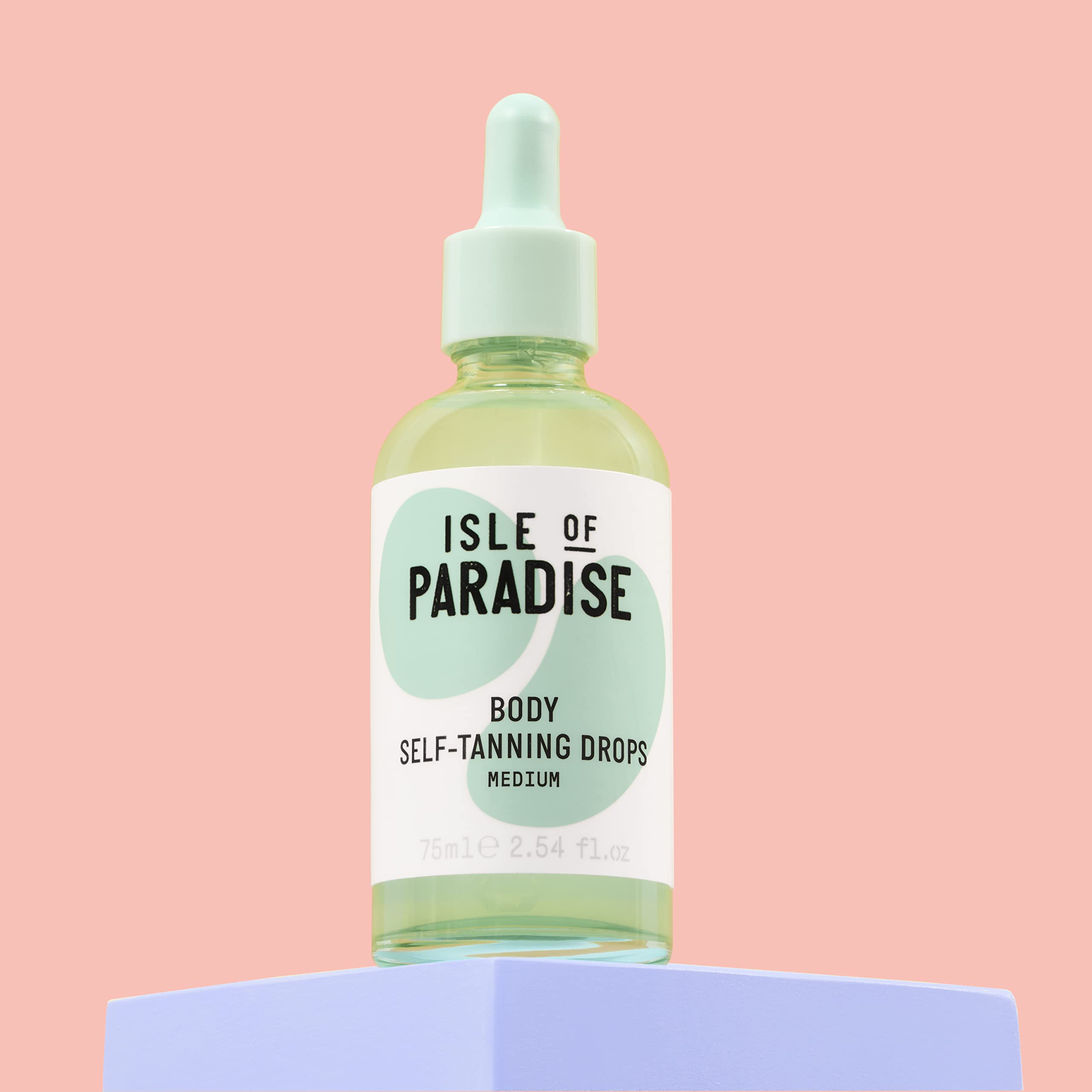 Isle of Paradise self tanning drops amber bottle close-up, fragrance-free and dermatologist-approved.
