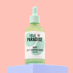 Isle of Paradise self tanning drops amber bottle close-up, fragrance-free and dermatologist-approved.