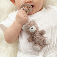 Detachable bear lovey attached to pacifier for easy transitions and cuddles