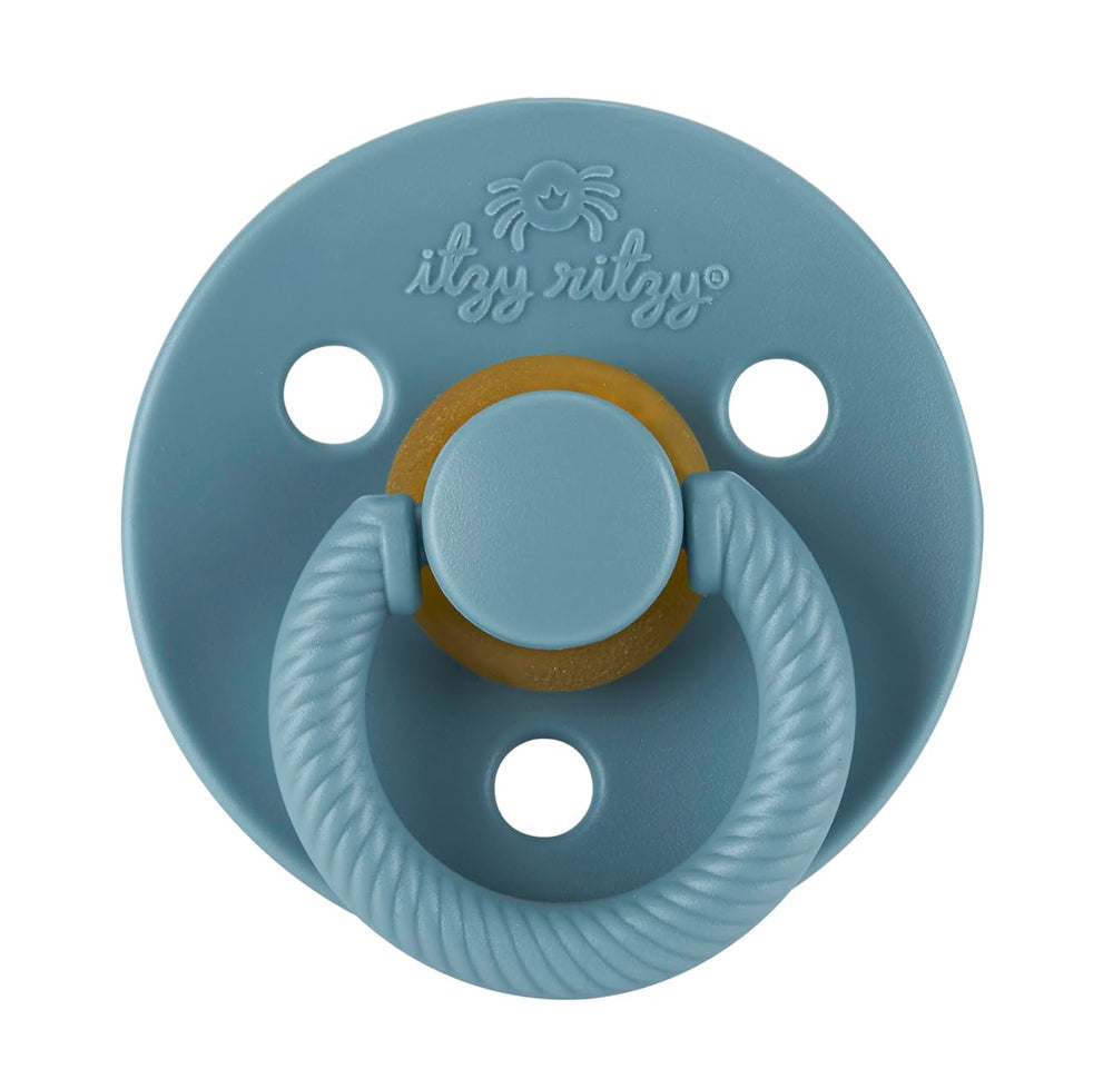 Itzy Ritzy natural rubber pacifier Coast with large air holes for airflow.
