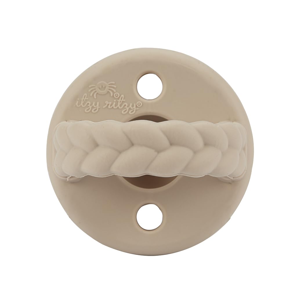Two Itzy Ritzy pacifiers in use for babies aged 6-18 months.