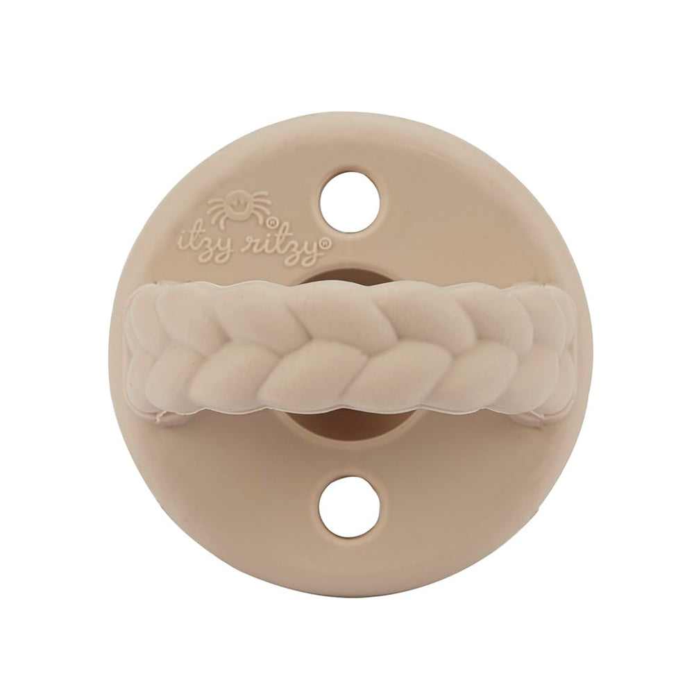 Two Itzy Ritzy pacifiers in use for babies aged 6-18 months.