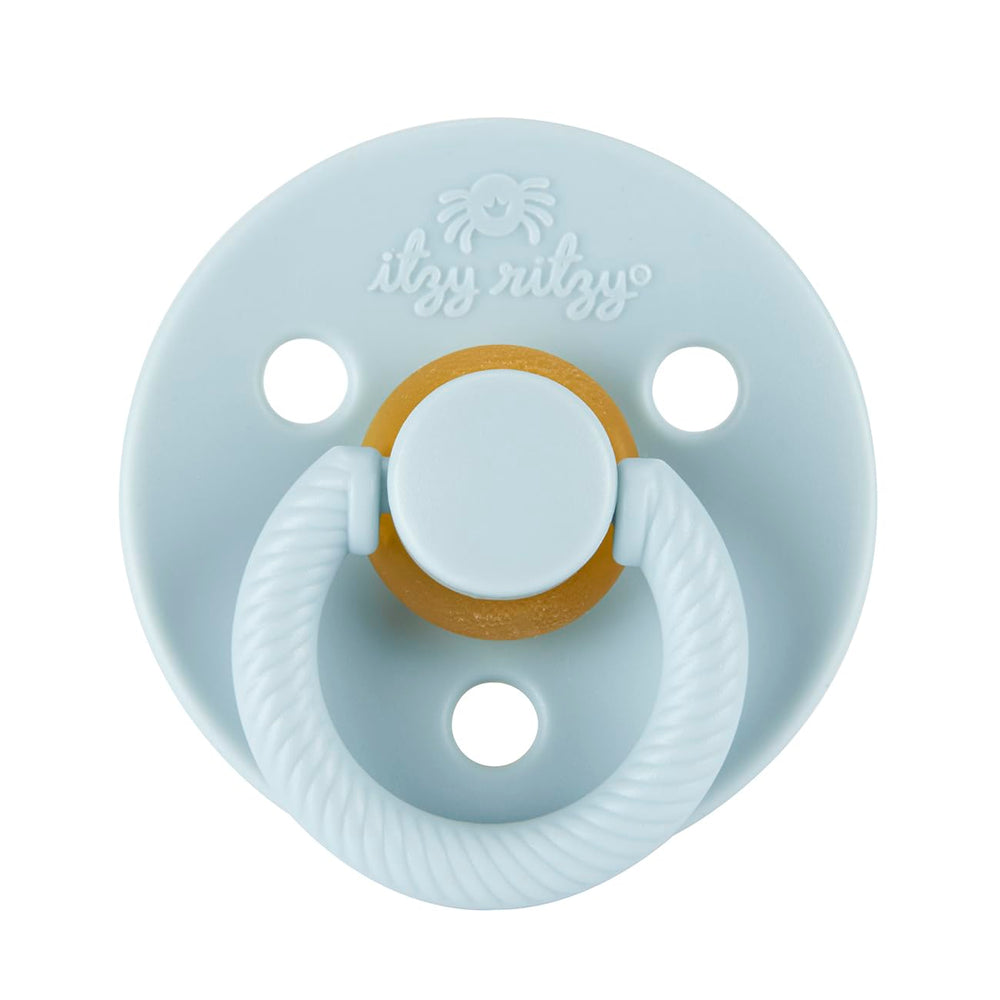Itzy Ritzy pacifier nipple close-up showing cherry-shaped design for breastfeeding-like feel.