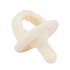 Close-up of Itzy Ritzy buttercream pacifier nipple for a soft, gentle feel.