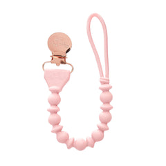 Itzy Ritzy silicone pacifier clip with pink beaded detail keeps pacifiers within reach.