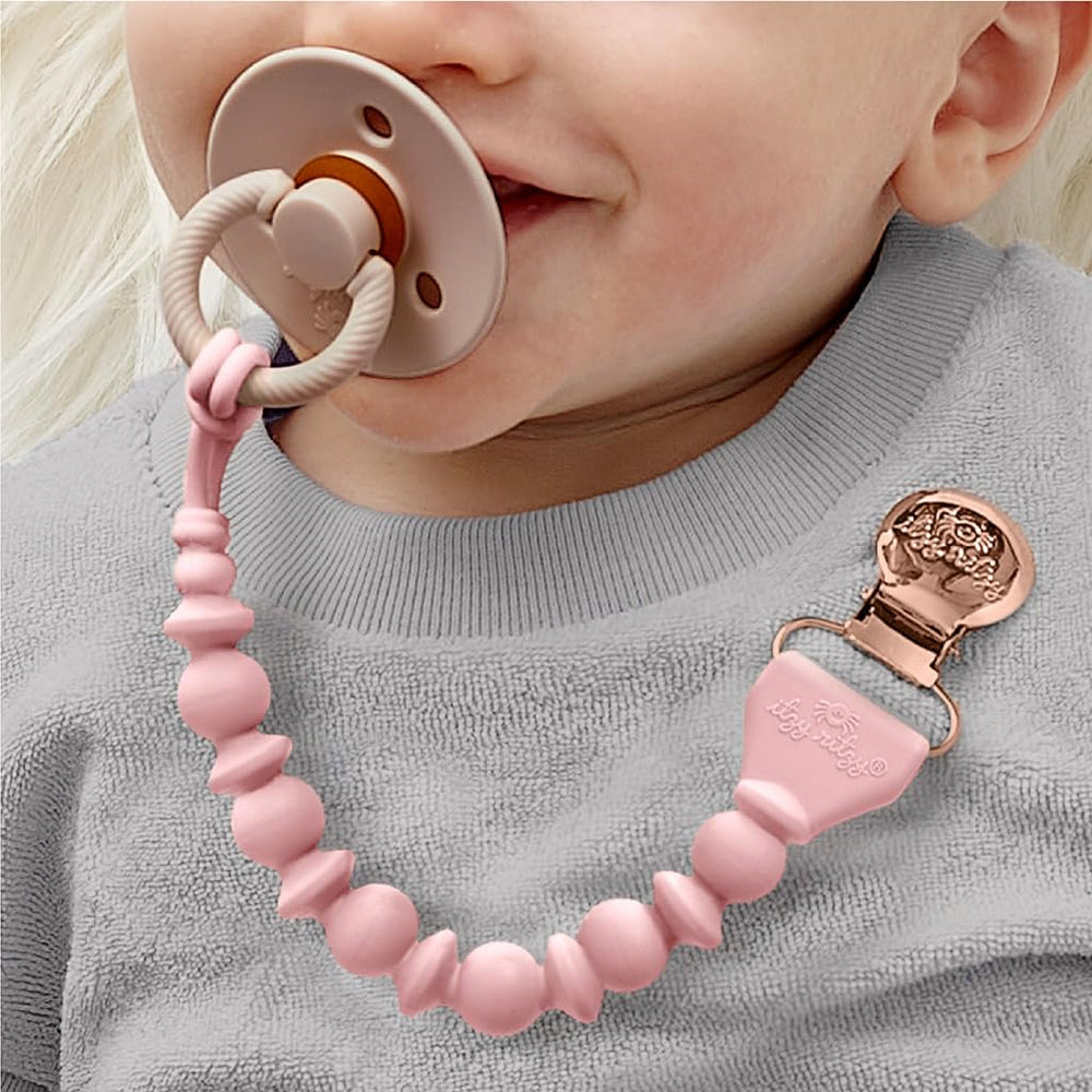 Close-up of Itzy Ritzy pacifier clip secure clasp prevents loss without snagging.