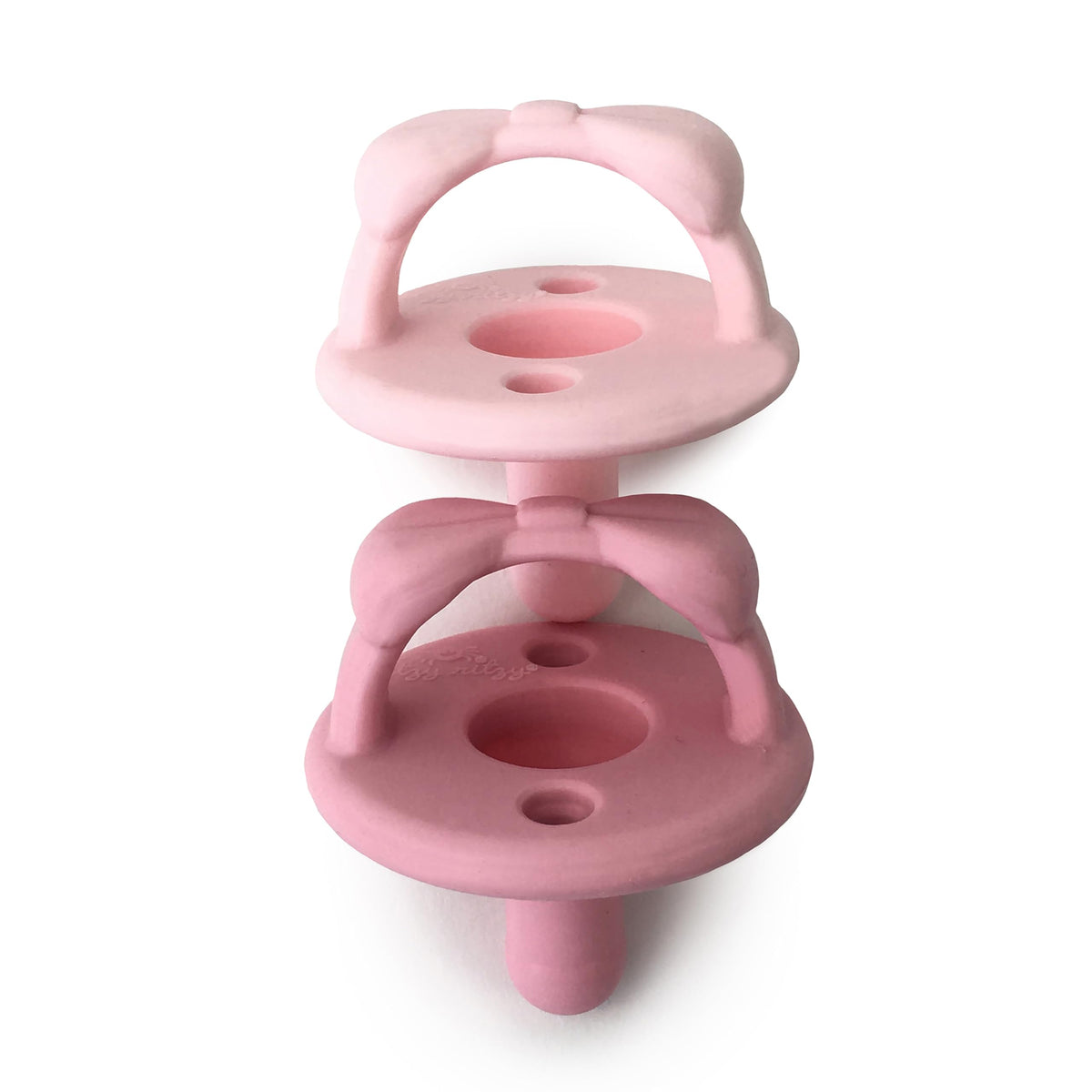 Itzy Ritzy silicone pacifier with collapsible handle in light pink for babies 6-18 months.