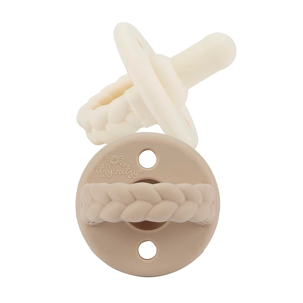 Itzy Ritzy pacifier coordinated with outfits for stylish everyday use.