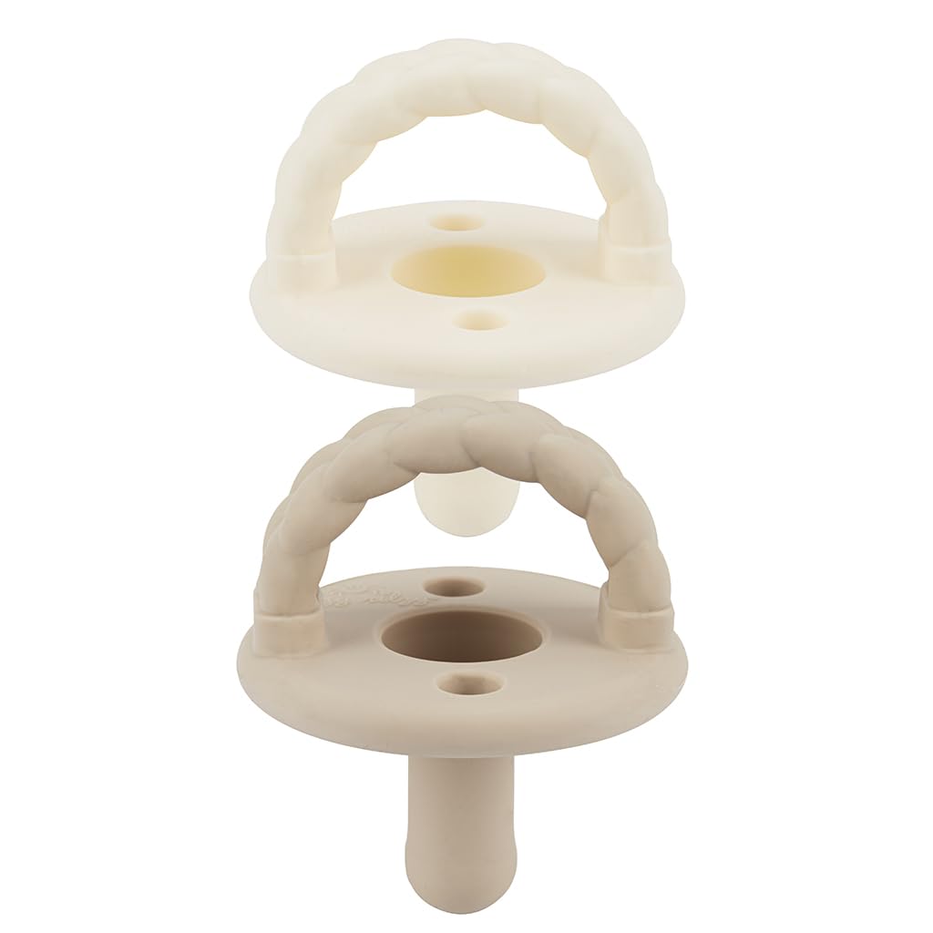Itzy Ritzy silicone pacifier set in Buttercream and Toast for soothing comfort.
