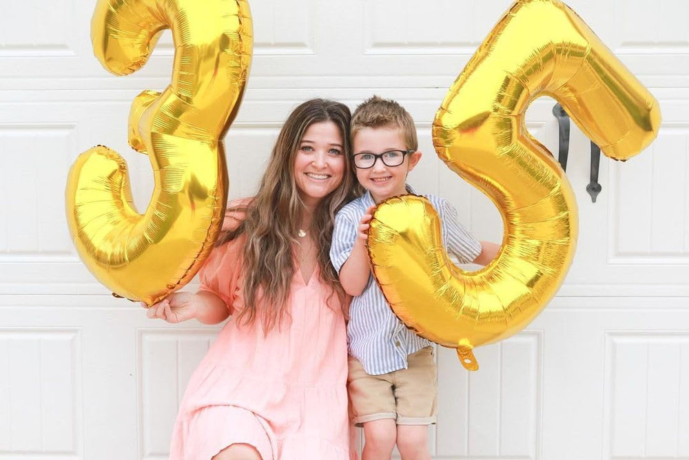 IWERP 5th birthday balloon in gold creates an elegant focal point