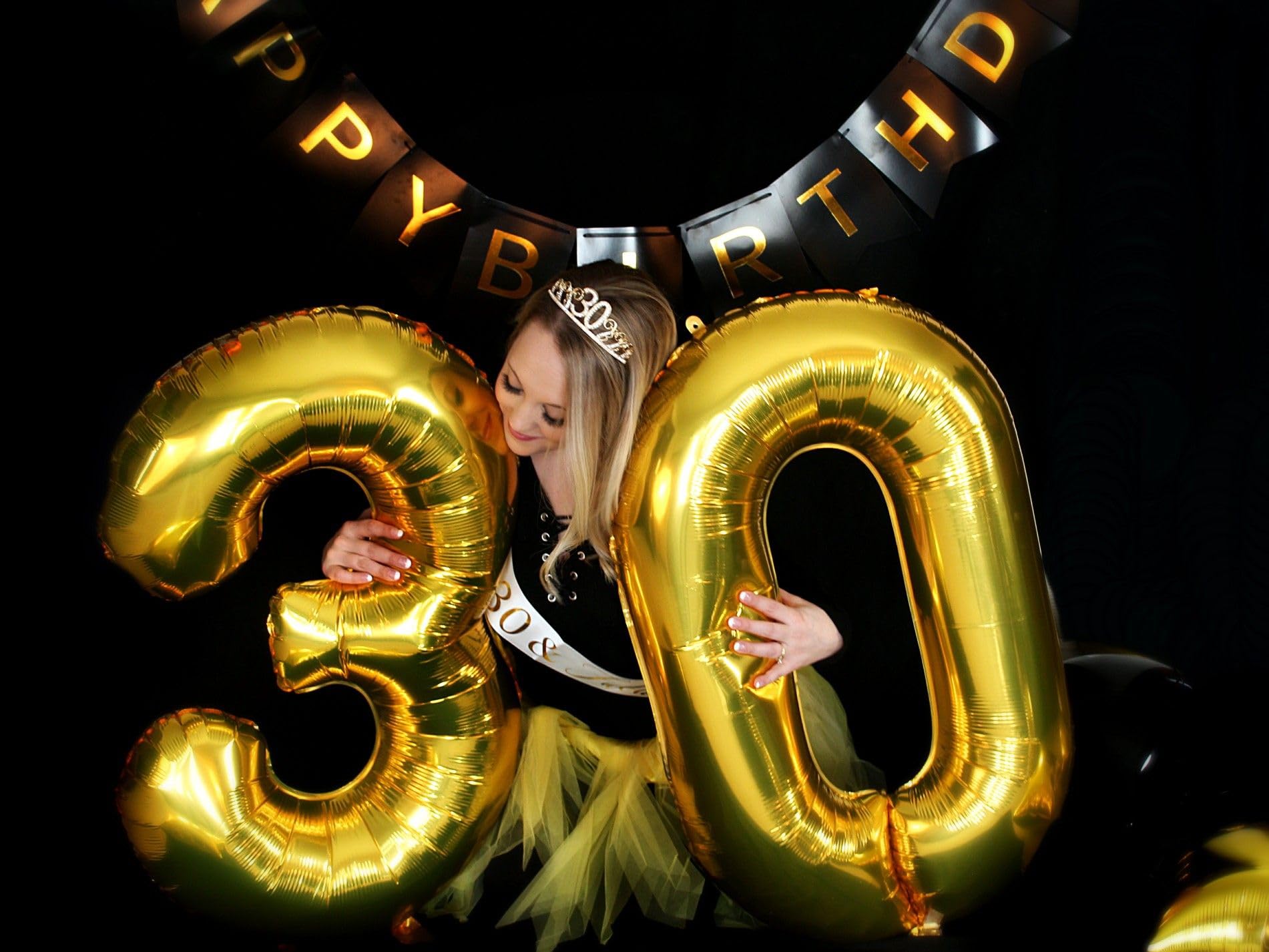 IWERP 60th birthday decorations in gold create a radiant backdrop.